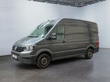 the van is parked in the large room of the building