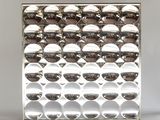 une image d'un objet métallique recouvert de nombreuses bulles