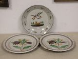 three plates that are sitting on a table