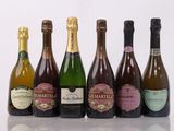 six bottles of wine are lined up in a row