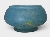 a blue vase with a green base on a white background