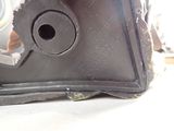 a close up of a piece of metal with a hole in it