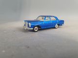 a blue toy car that is sitting on a table