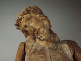 a wooden statue of a man with a beard