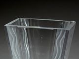 a glass vase that is sitting on a table