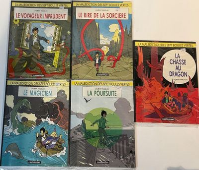 several books on a table with a picture of a man in a boat and a dragon