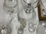 a lot of glass items that are on a table
