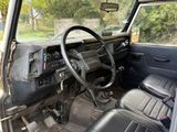 a car with a steering wheel and a dash board