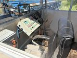 an image of a machine that is working on a piece of machinery