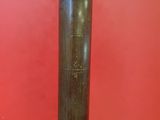 a close up of a metal pipe on a red surface
