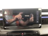a picture of a car dashboard with a cell phone in it
