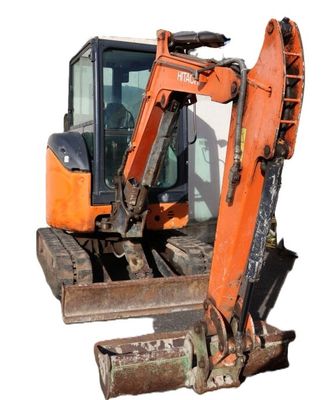 a small excavator that is sitting on the ground