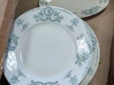 two plates in a box that are sitting on top of each other