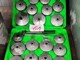 a green case with a bunch of tools inside of it