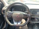 dashboard view of a car with a steering wheel and dashboard controls