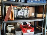 a shelf with pots and pans on top of it