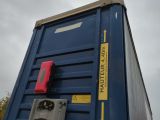 a blue box with a red handle on it