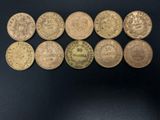 a close up of a bunch of coins sitting on top of a table