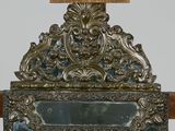 a mirror that is sitting on top of a wooden table
