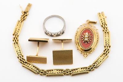 three pairs of gold and silver cufflinks, a ring, and a bracelet