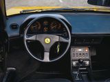 a steering wheel and dashboard of a yellow sports car