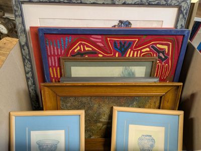 two framed pictures of vases and a vase on a table