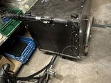 a black suitcase sitting on the floor next to a bike