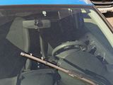 a blue car with a steering wheel and a steering stick in it