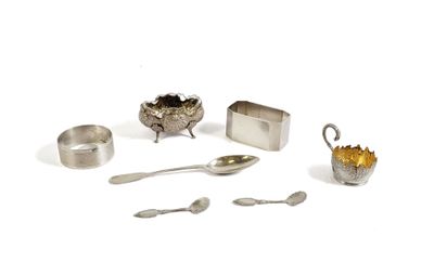 a silver plate with spoons, spoons, and other items on it