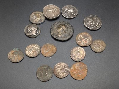 some old coins are arranged in a circle on a table