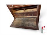 an old wooden chest with a drawer inside of it