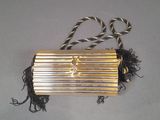 an image of a gold purse on a table
