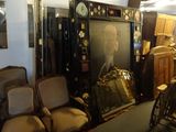 a room with a lot of chairs and pictures on the wall