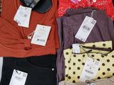 a pile of clothing that is on a table