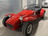 an image of a red sports car parked in a garage