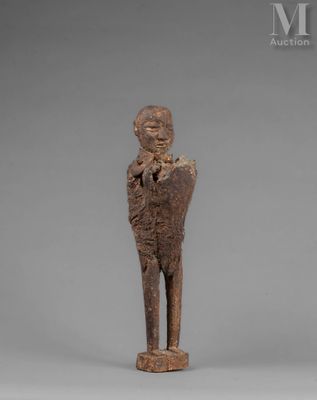 an image of a wooden statue of a man holding a baby