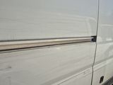 a white van that is parked in a parking lot