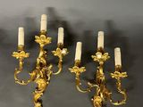 four candles that are on the wall in the room