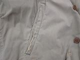 a close up of a jacket with buttons on it