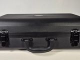 a black suitcase sitting on top of a white box