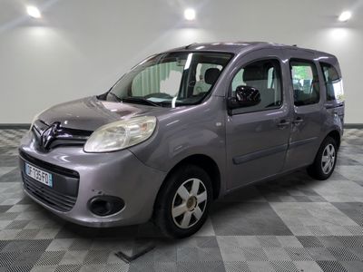 a picture of a small grey van parked in a garage