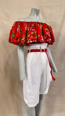 a mannequin wearing a red and white dress with flowers on it