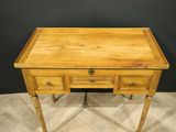 a wooden desk with two drawers and a drawer underneath it