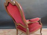 an old chair with red upholstered upholstered upholstered upholstered upholstered upholstered upholstered upholstered upholstered