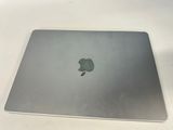 an apple macbook pro laptop computer sitting on top of a white table