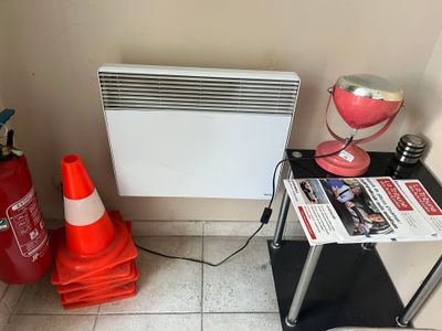 an image of a room with a radiator and a fire hydrant