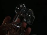 a person holding a glass of water in their hand