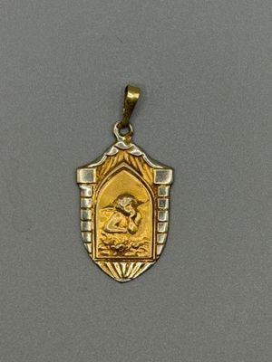 une image représentant une médaille d'or et d'argent sur laquelle figure une femme