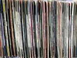 a close up of a bunch of records stacked on top of each other