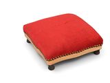 a red foot stool with a wooden frame and wooden legs